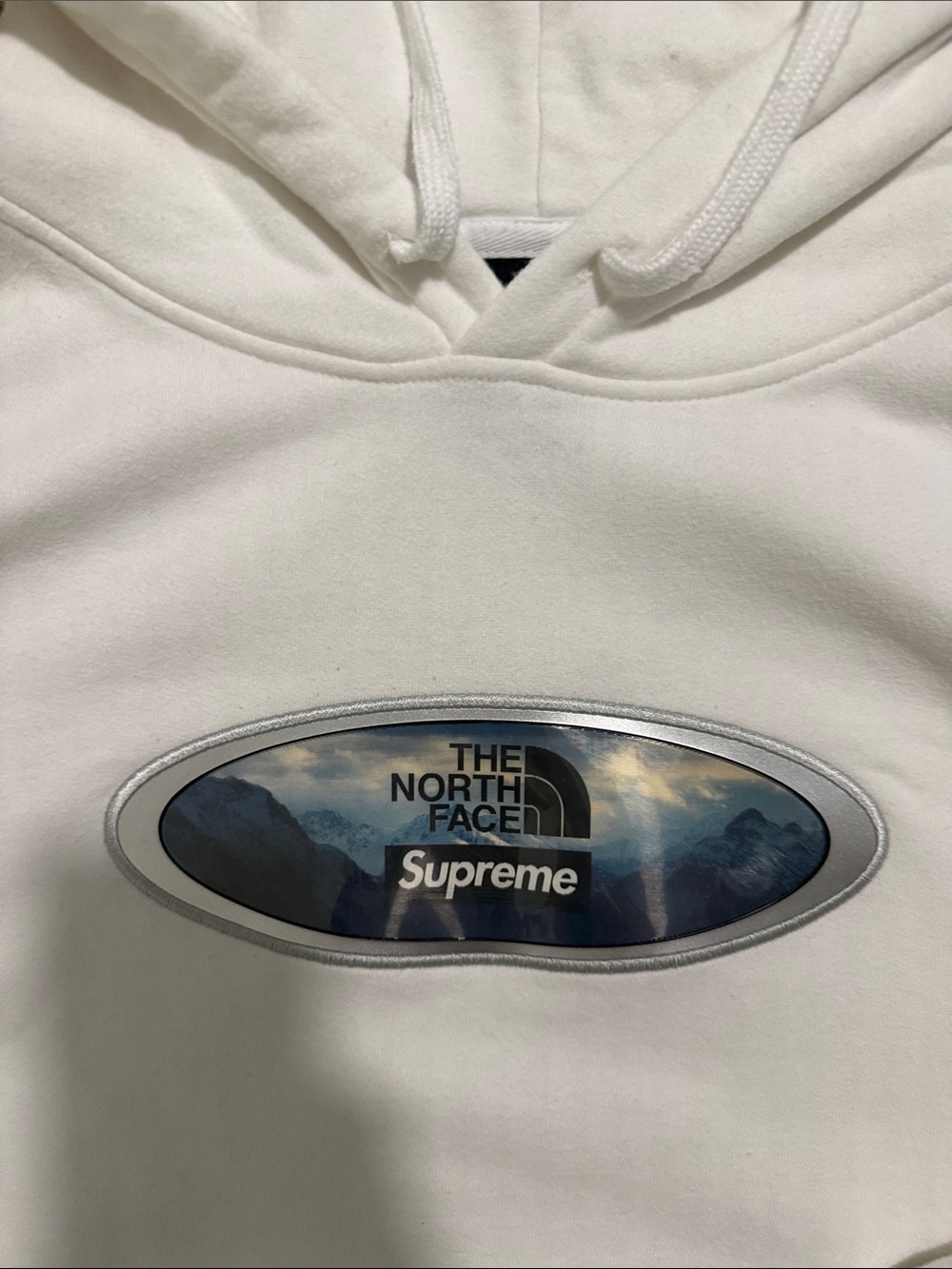 Supreme White Hoodie with Metallic Oval Logo